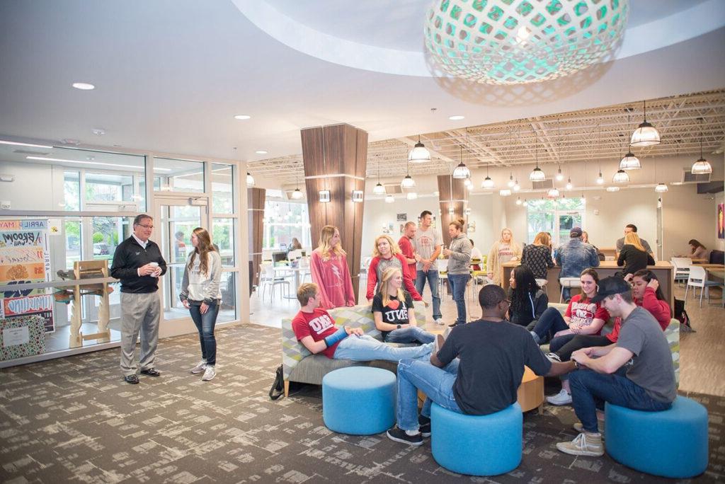 crowd of students in a campus common area