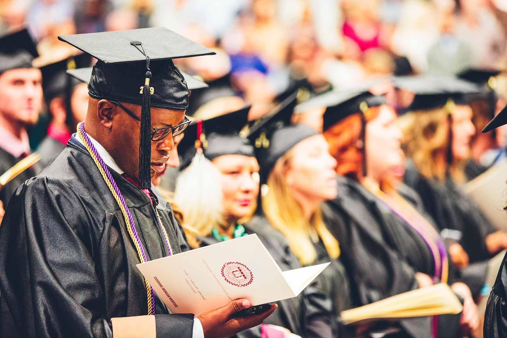 SNU graduate sitting at December 2019 Commencement