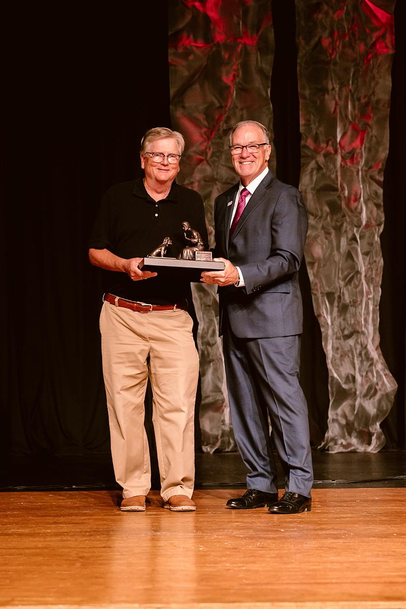 Phil white receiving award from Dr. Keith Newman